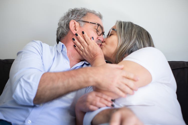 An Elderly Couple Kissing