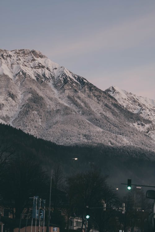 Snow Covered Mountains Under the Blue Sky