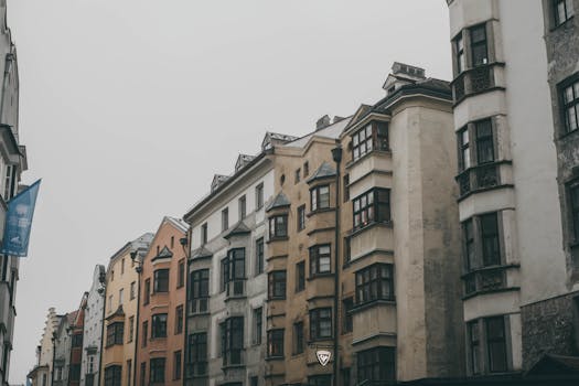 Beautiful row of historic buildings in Austria under an overcast sky, showcasing European architectural charm.