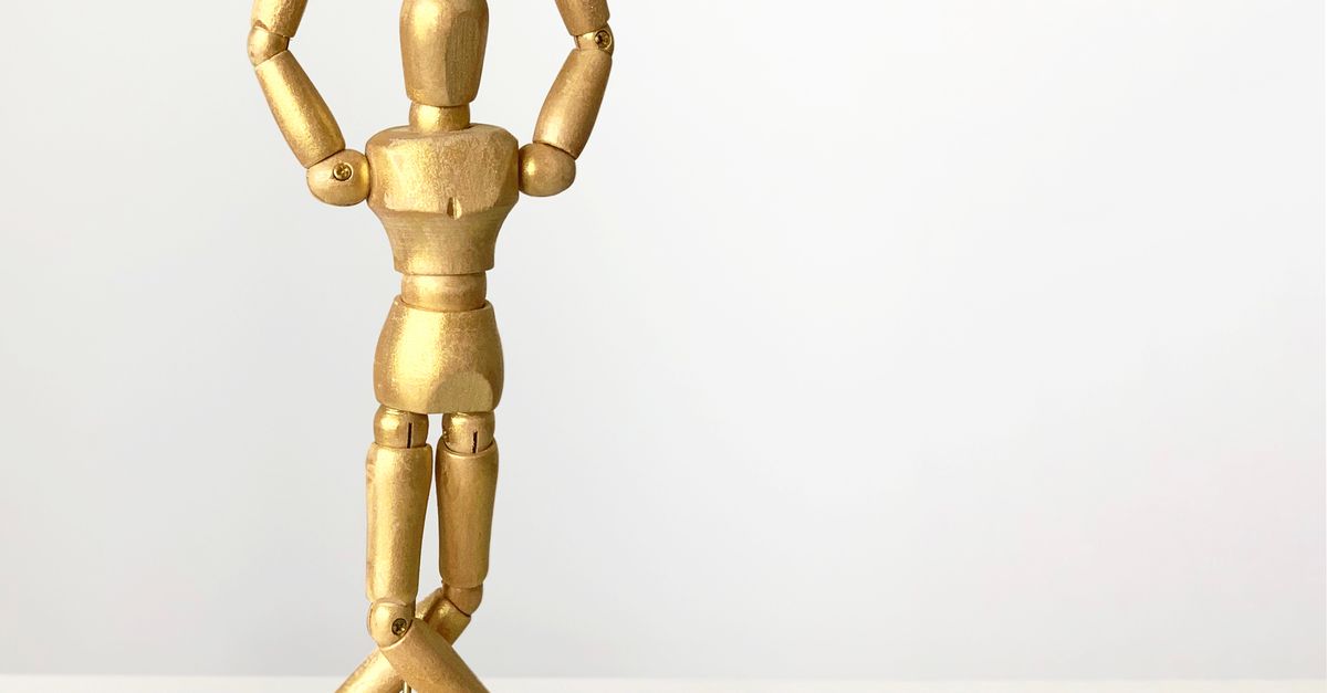 Brown Wooden Human Figure on Brown Wooden Table · Free Stock Photo