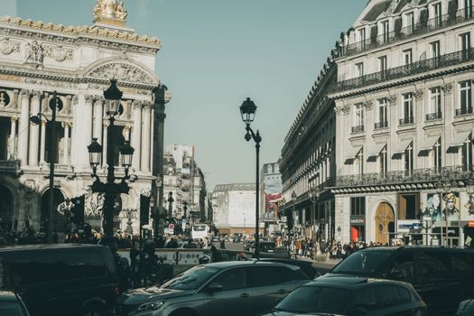 A vibrant street scene capturing the hustle and bustle near Paris's iconic Palais Garnier.