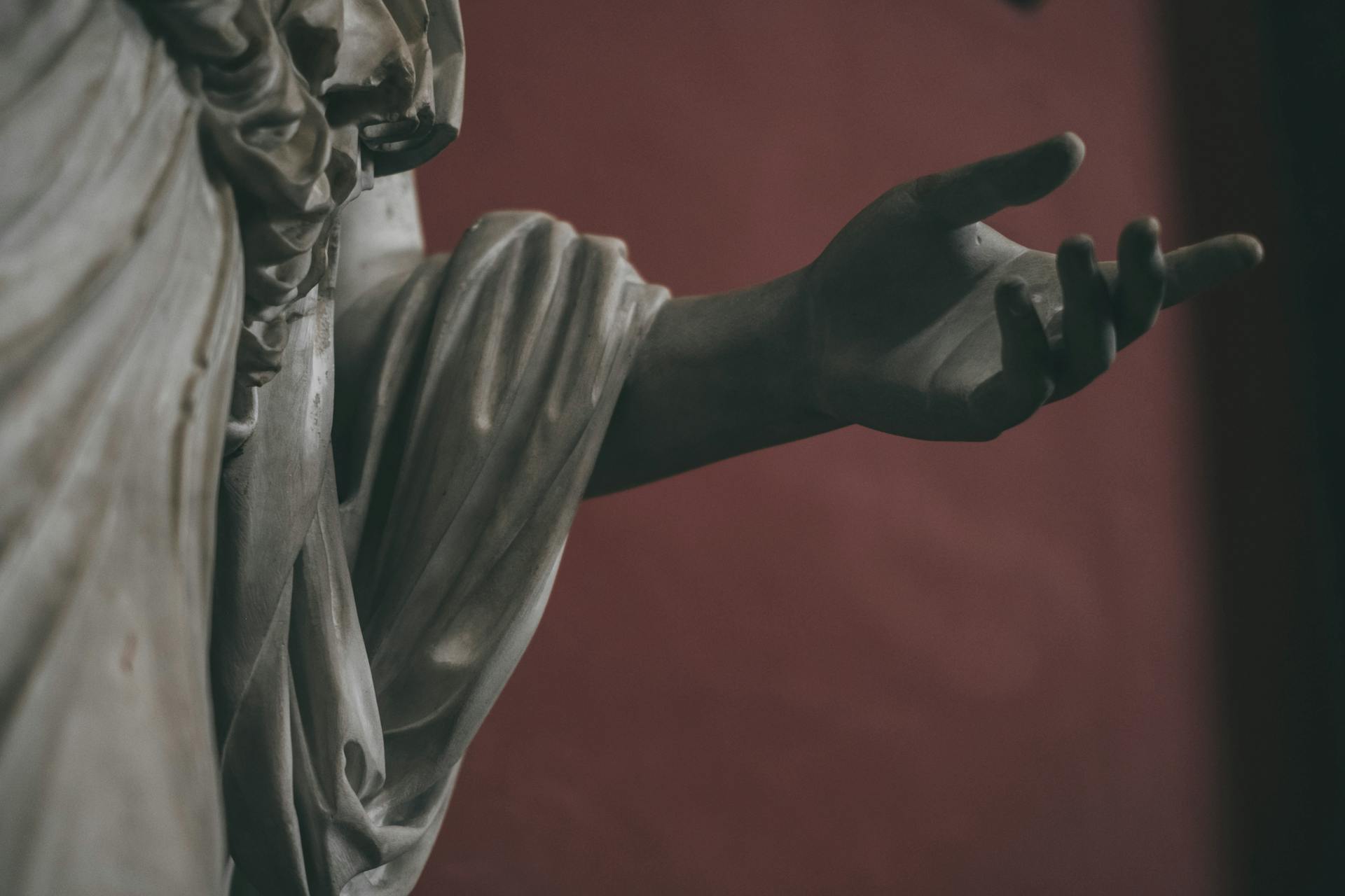 Close-up of a marble sculpture hand in Italy showcasing delicate craftsmanship.