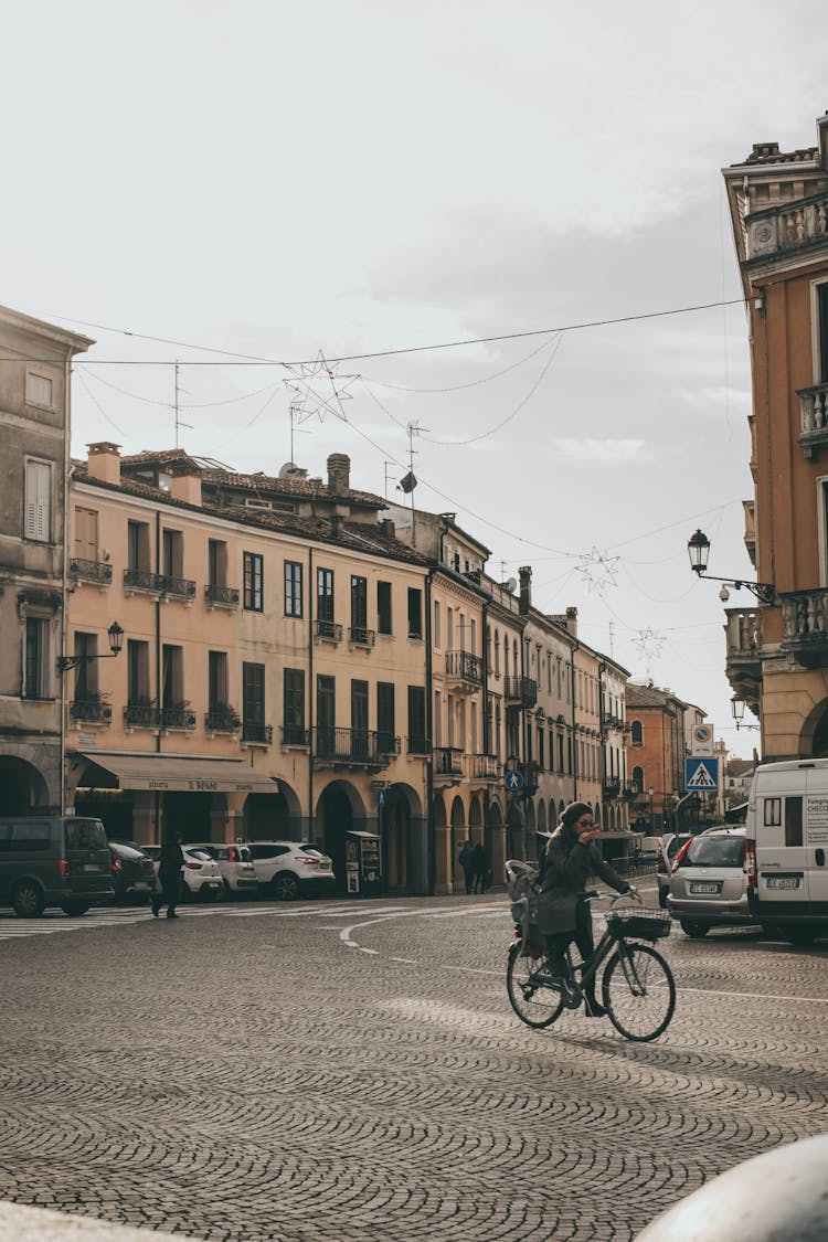 Woman Riding Bicycle On Road