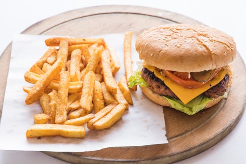 Free Close-Up Shot of Burger and French Fries on a Tray Stock Photo