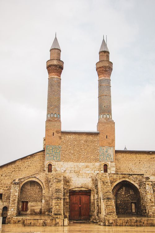 Free Explore the historic architecture of Cifte Minareli Medrese in Sivas, featuring unique twin minarets. Stock Photo