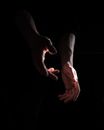 Hands of crop man in darkness