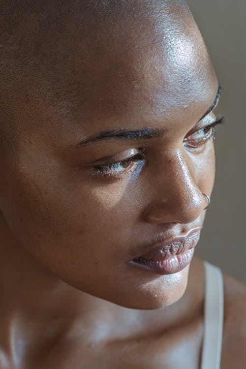 Close-Up Photo of a Woman with a Nose Piercing