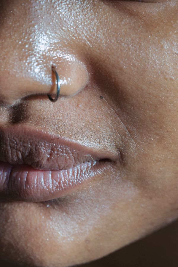 Close-up of lips and nose with a nose ring — photo by Angela Roma on Pexels