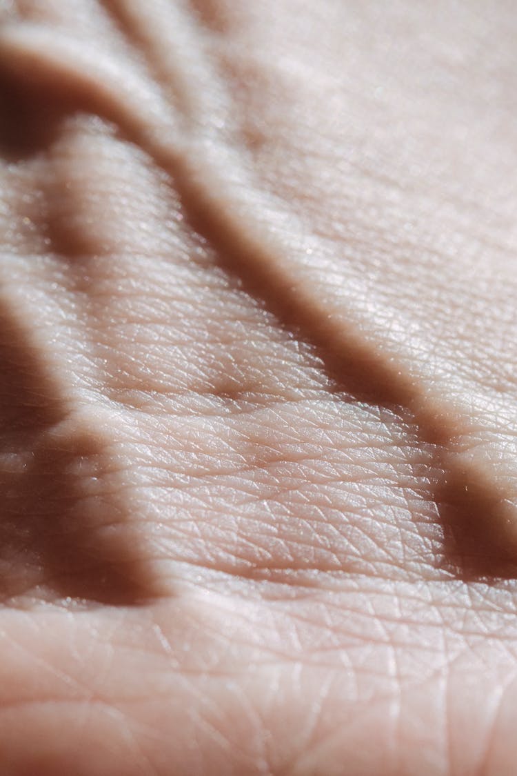 Hand Of Faceless Person In Light Room