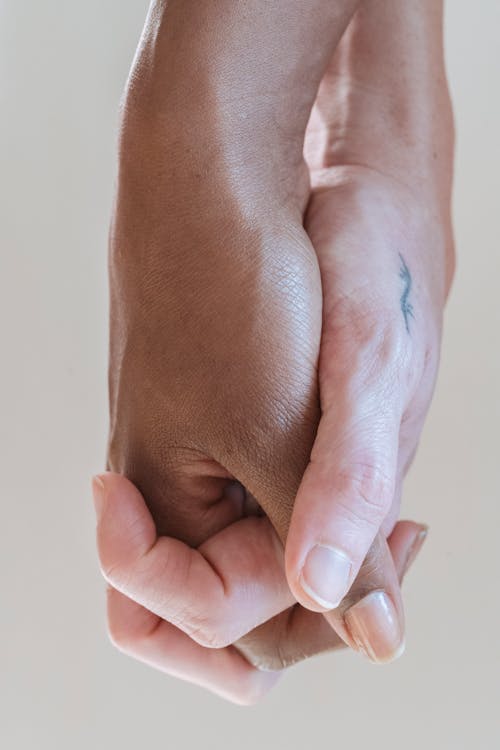Free Close-Up Shot of Hands Holding Stock Photo