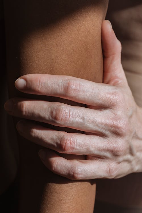 Woman touching hand of black person