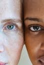 Woman with freckled face near black model