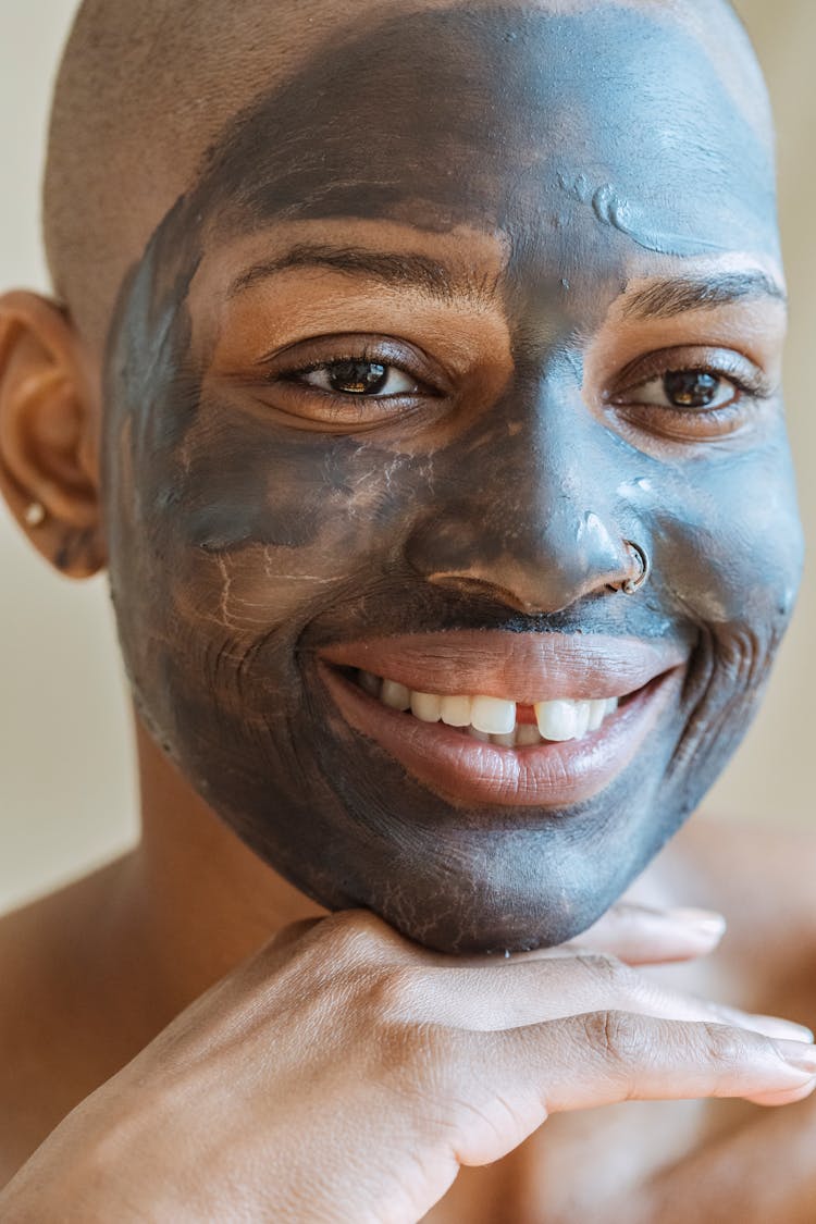 Black Woman With Cosmetic Mask On Face