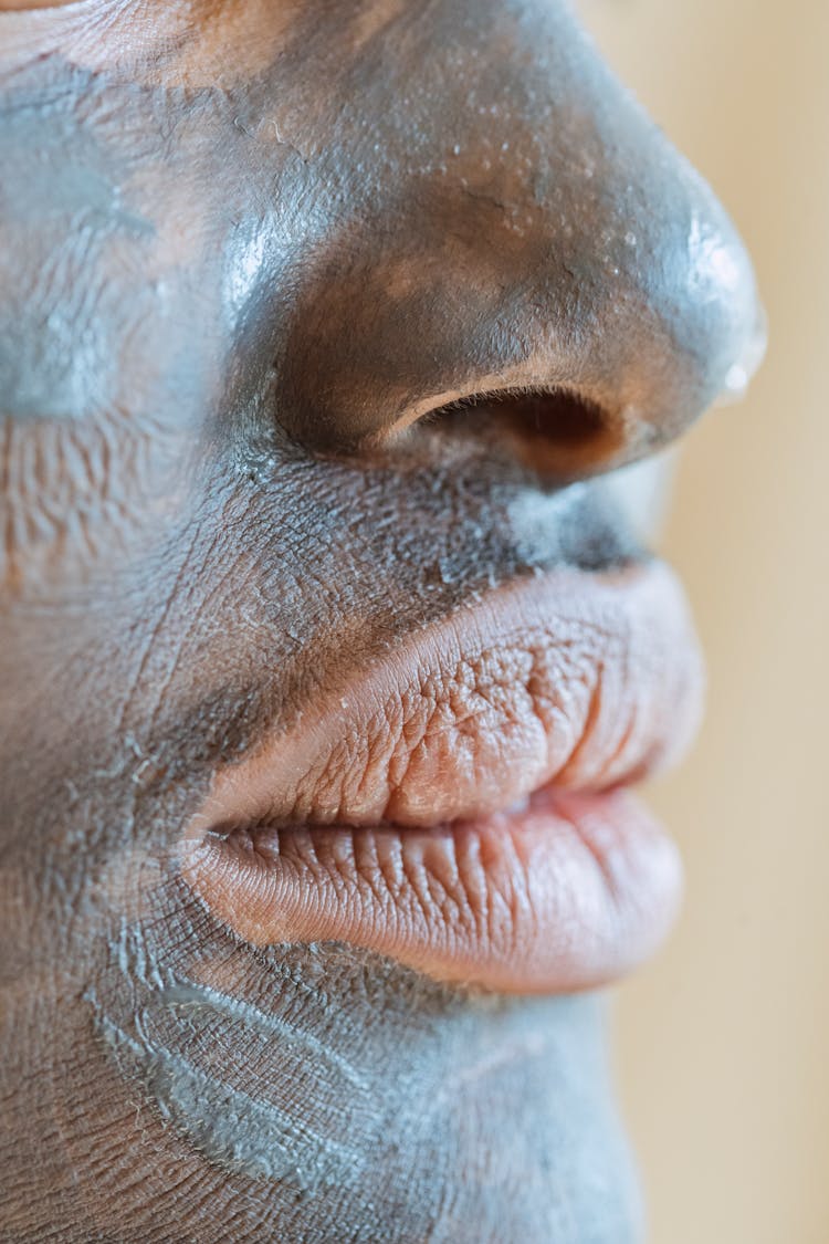 Crop Black Woman With Cosmetic Mask