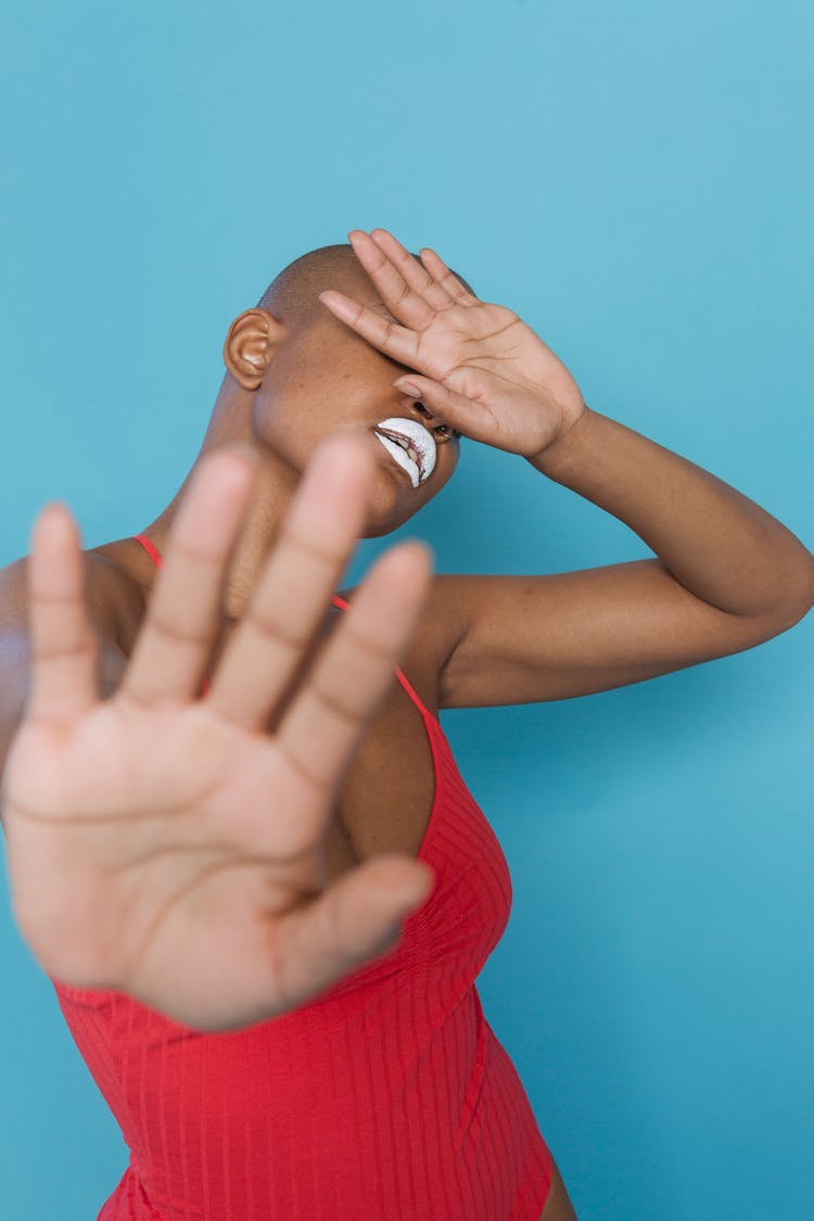 African American Female Holding Out Palm In Stopping Gesture