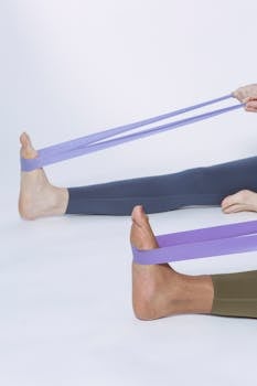 Feet stretching with resistance bands for home workout and wellness