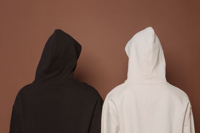 Back view of models in oversize hooded sweatshirts — photo by Angela Roma on Pexels