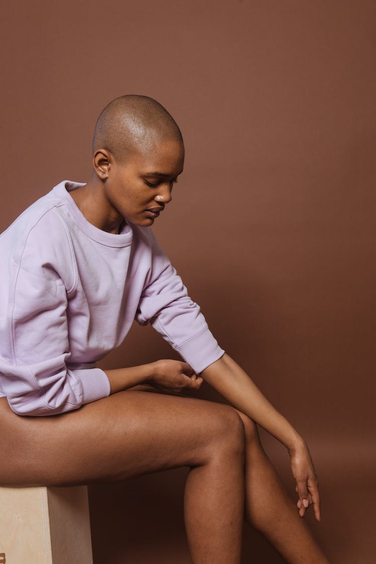 Bald Black Woman With Care Legs