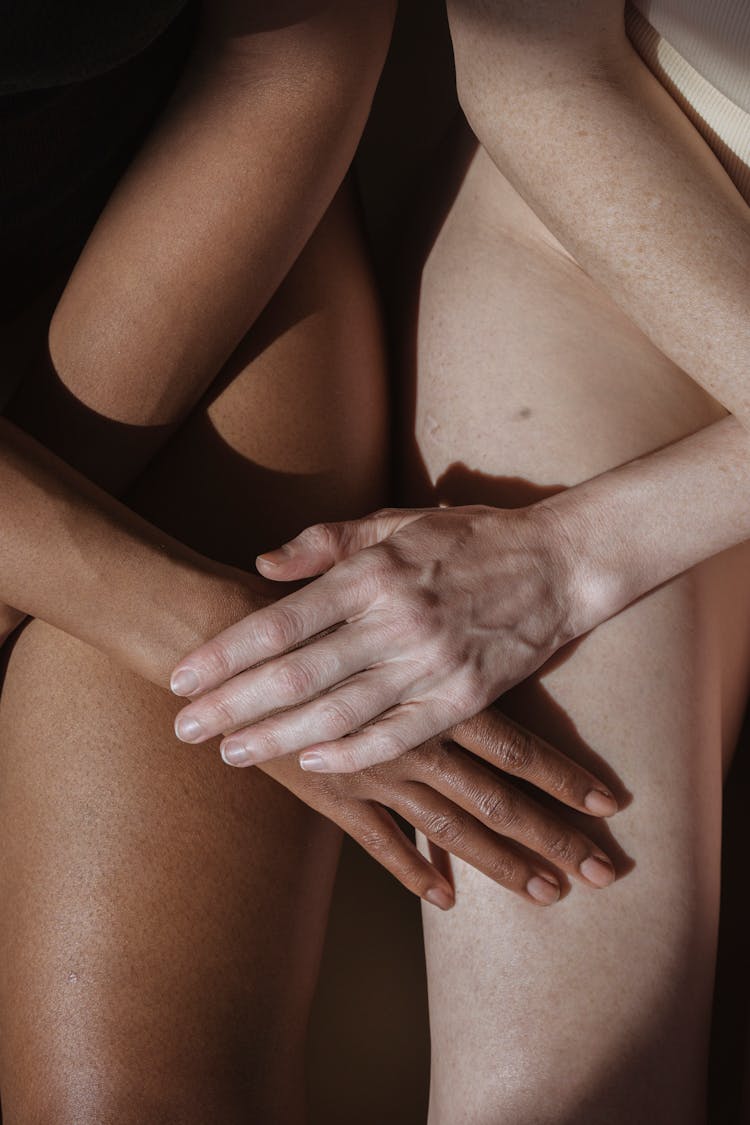 Crop Model Caressing Hand Of Black Partner