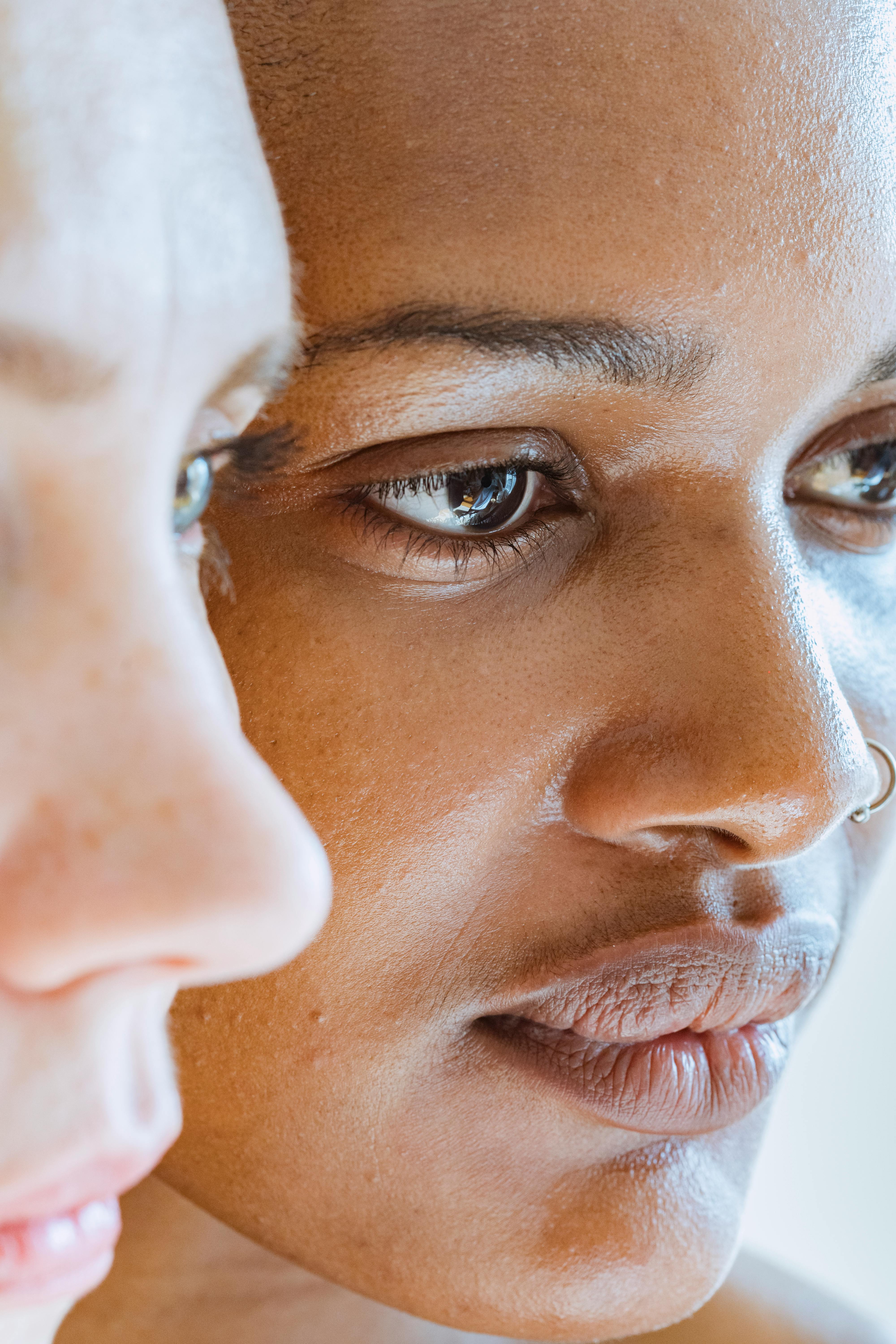 multiethnic women standing and looking away