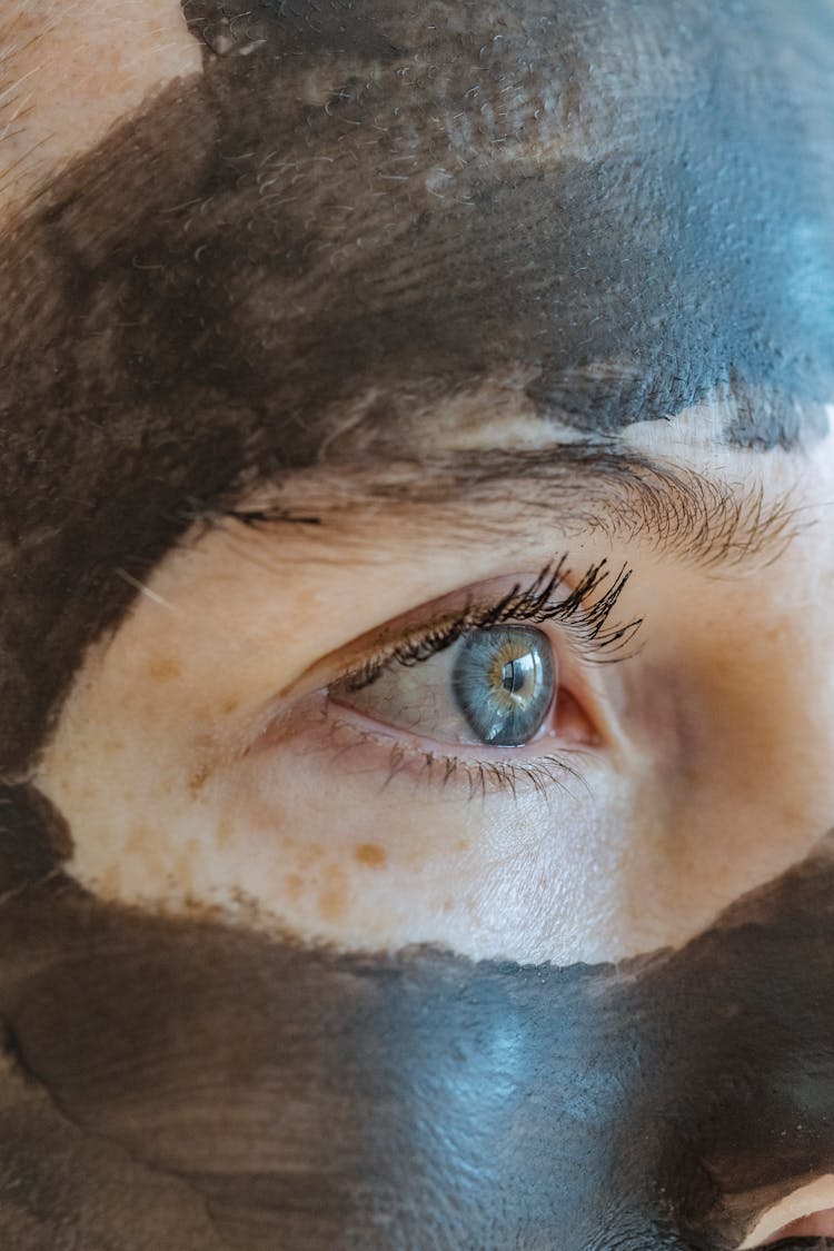 Woman With Cosmetic Mask On Face