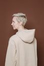 Woman in hoody in studio