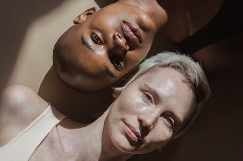 Multiracial female models lying on floor