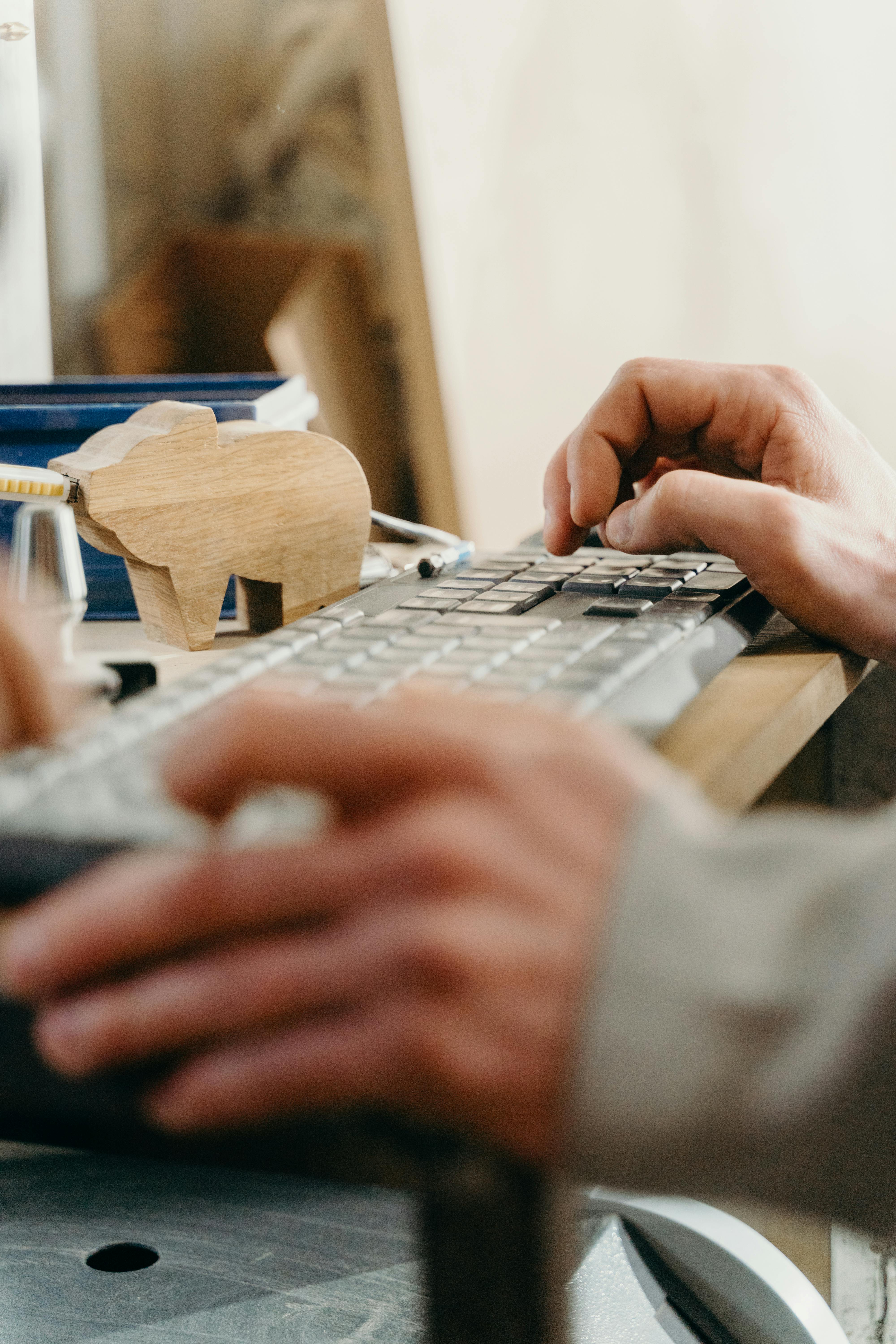 person using white computer keyboard