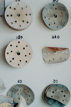 Sand Papers of Different Grade on the Wall