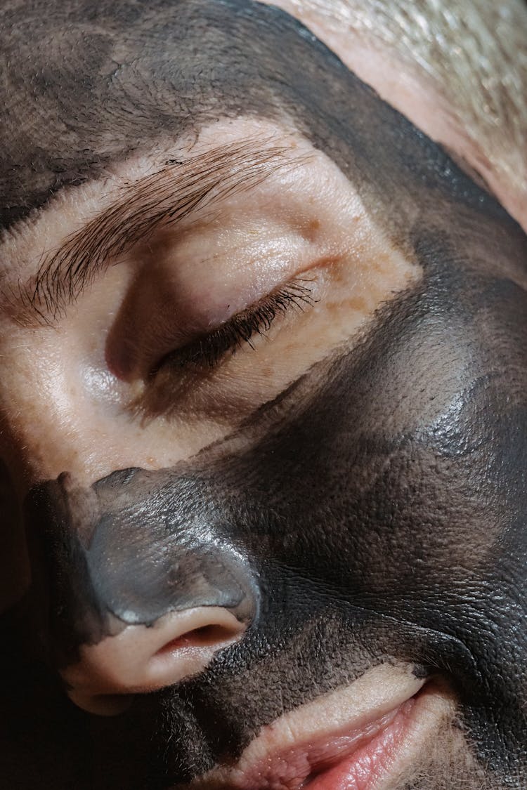 Woman With Mask Relaxing During Skincare Routine