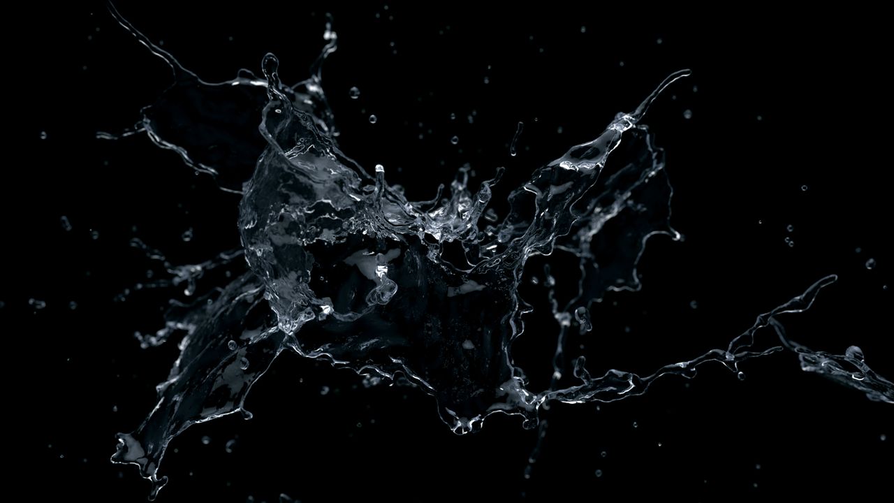 dynamic close up of water splash against a black backdrop highlighting
