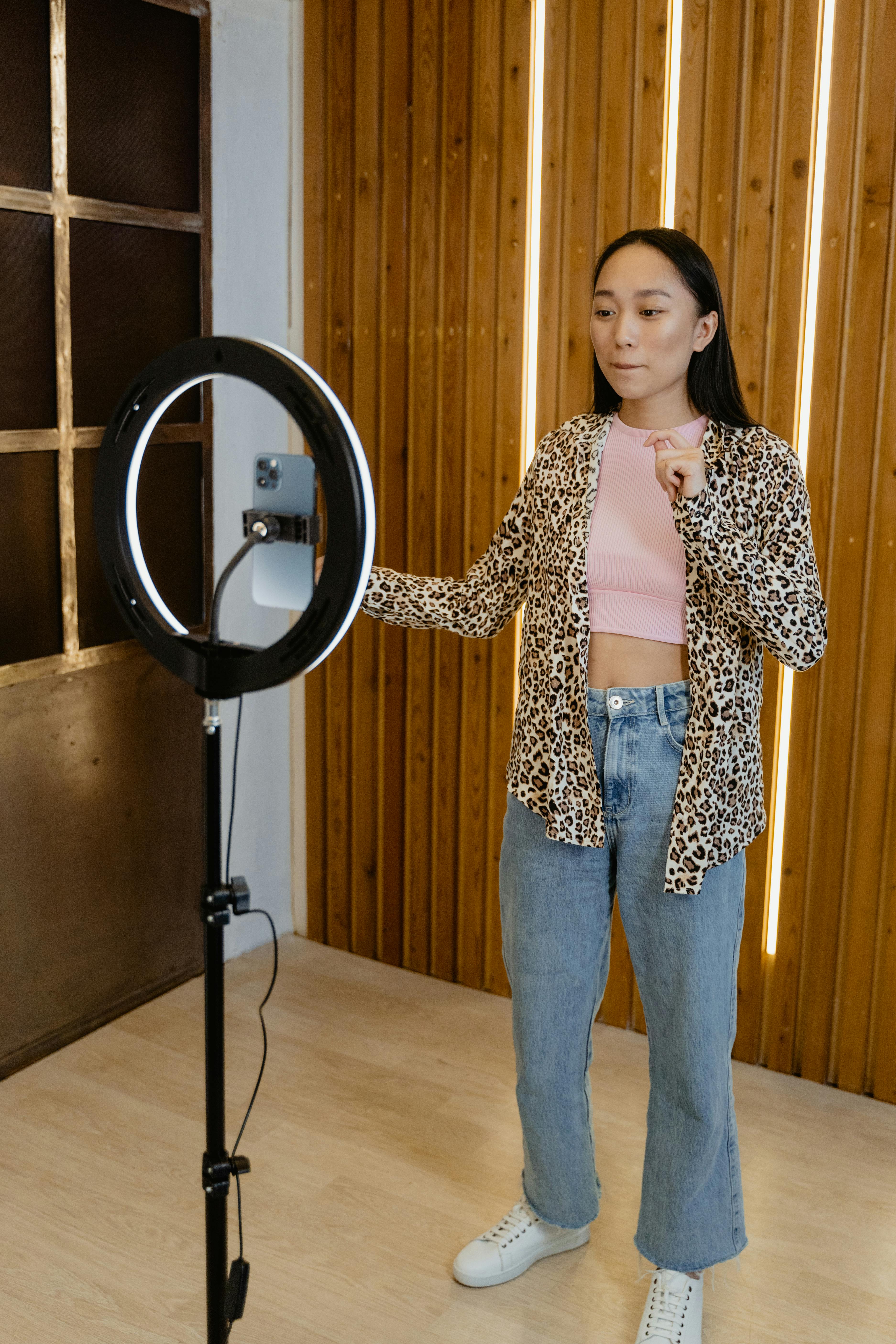 a woman in leopard print jacket looking at the camera
