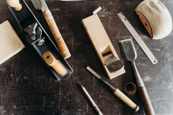 Workshop table with an assortment of woodworking tools