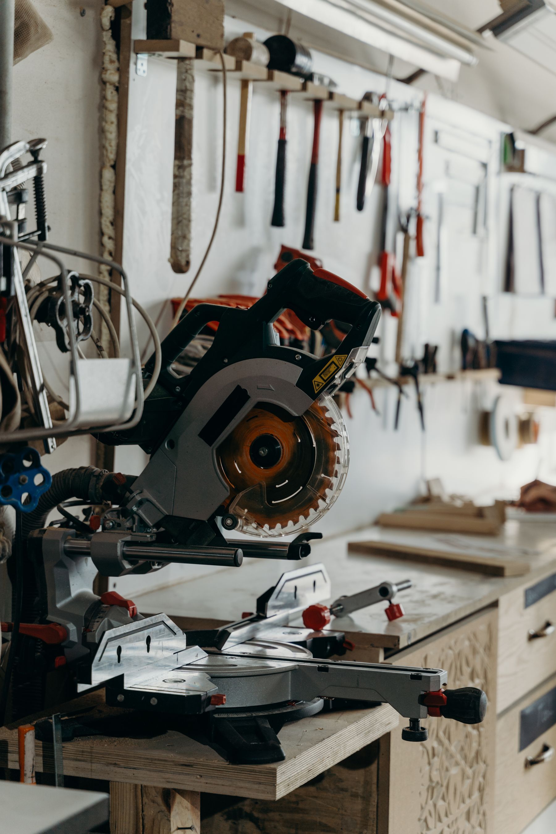 Circular saw resting on a professional woodworking bench with workshop tools nearby