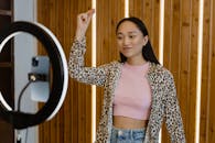 A Young Woman in Pink Top and Leopard Print Cardigan