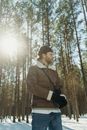 Woman in Brown Coat Standing in Forest