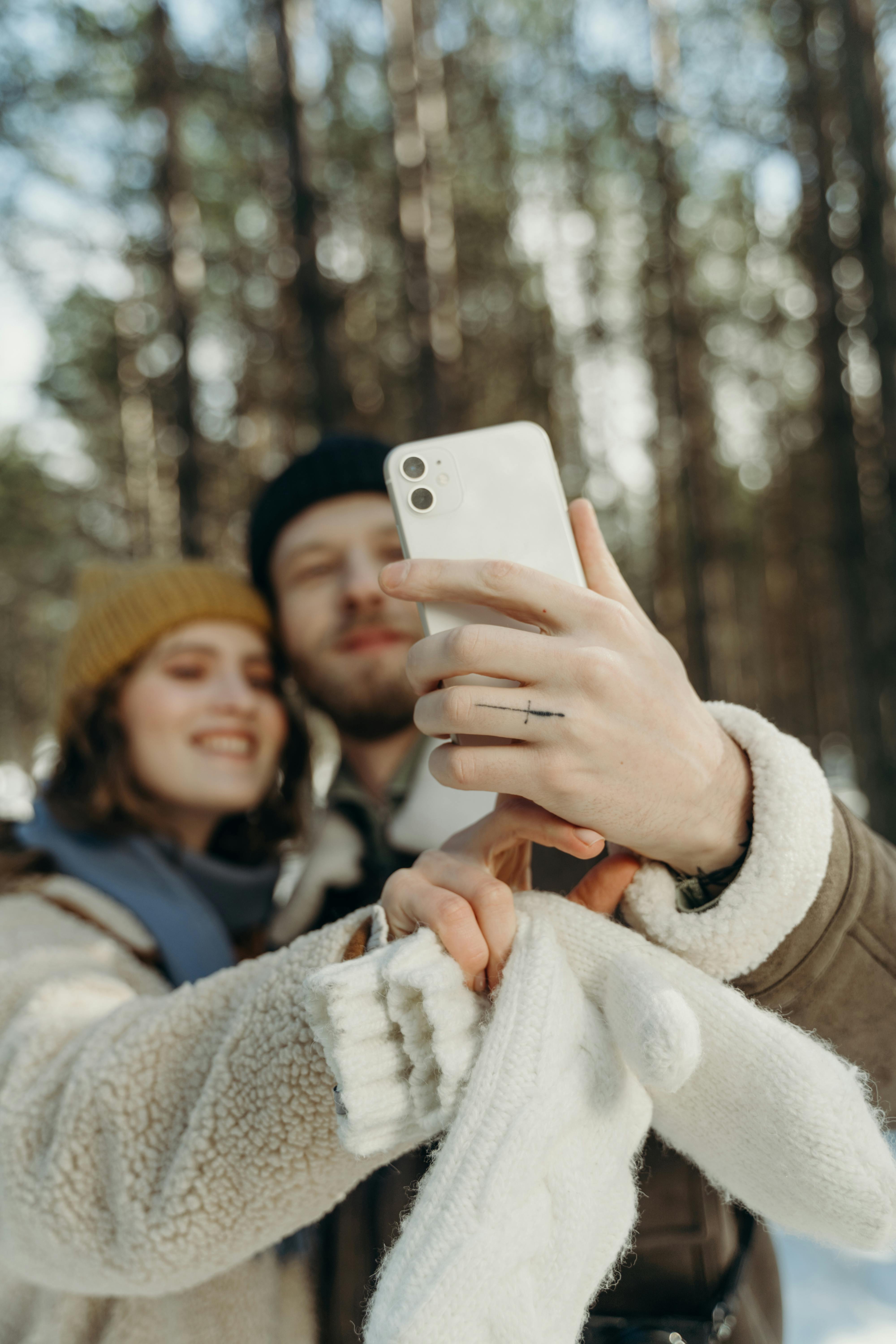 man taking selfie with a woman