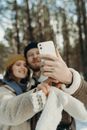 Woman in Gray Coat Holding White Iphone 5 C
