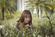Woman Holding Purple Flower