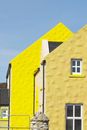Yellow Concrete Building Under Blue Sky