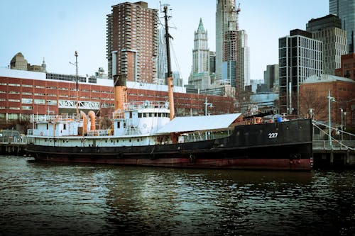 Freighter Anchored in City 