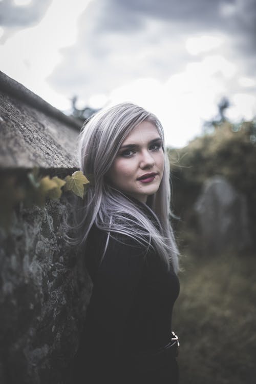 Selective Focus Photo of a Woman with Ash Gray Hair Looking at the Camera