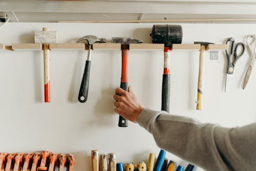 Person Holding a Hammer