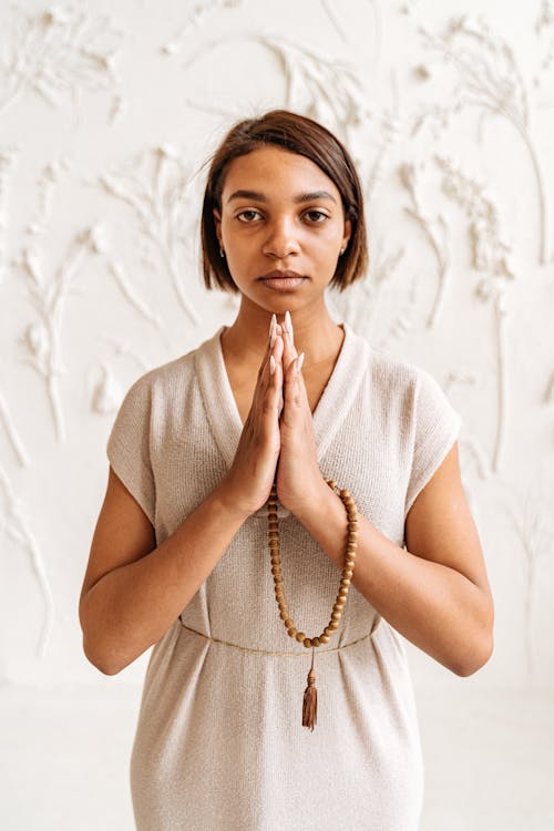 A Woman Holding Prayer Beads 