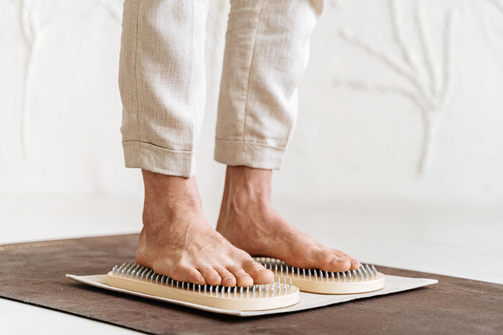 Bright clinic setting with a person receiving foot and ankle support guidance