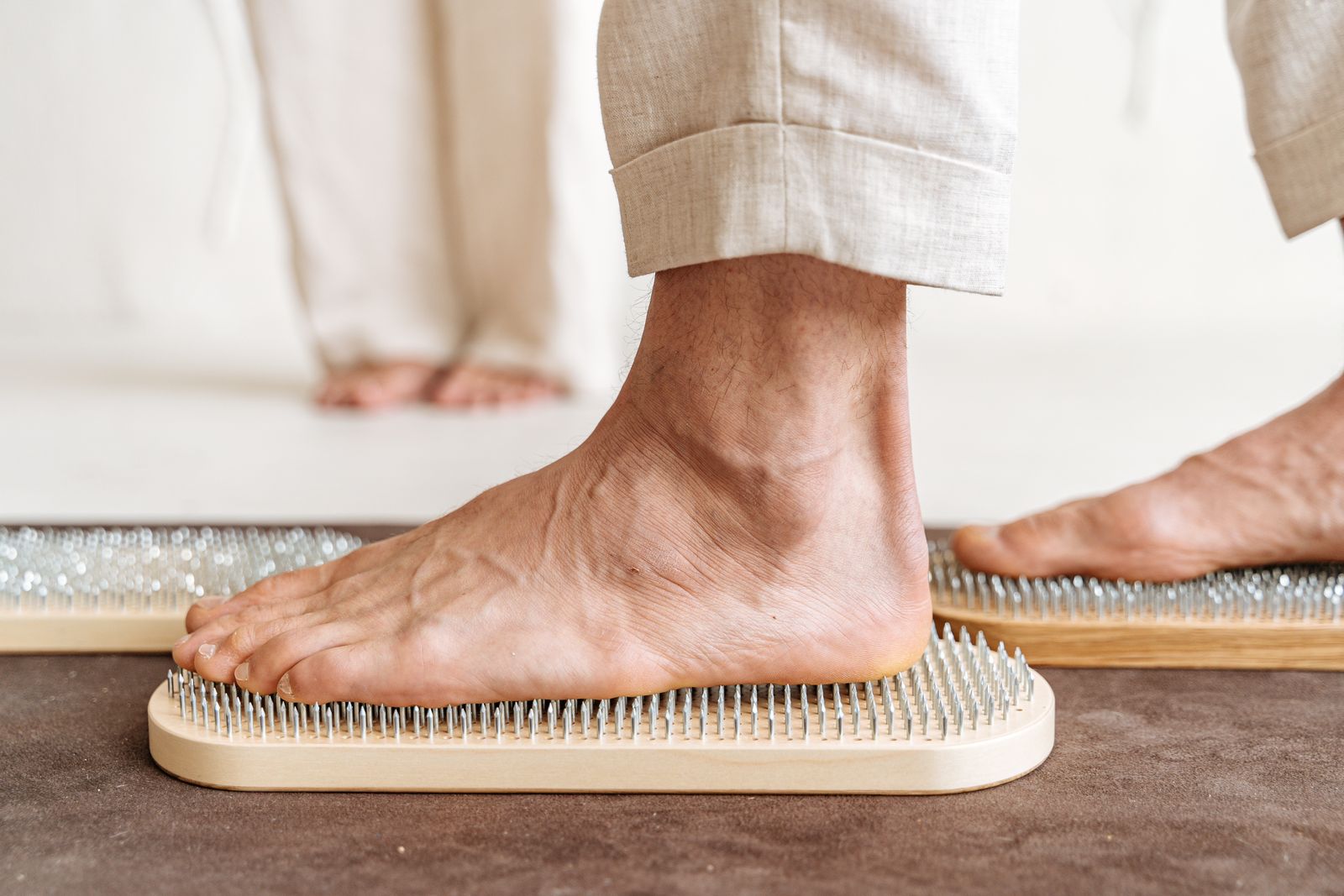 Person adjusting a foot support before walking outdoors