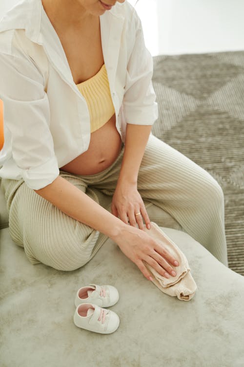 A Pregnant Woman Sitting on the Sofa