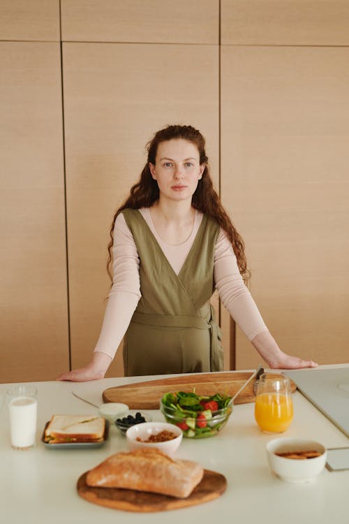 A Woman Standing at the Table