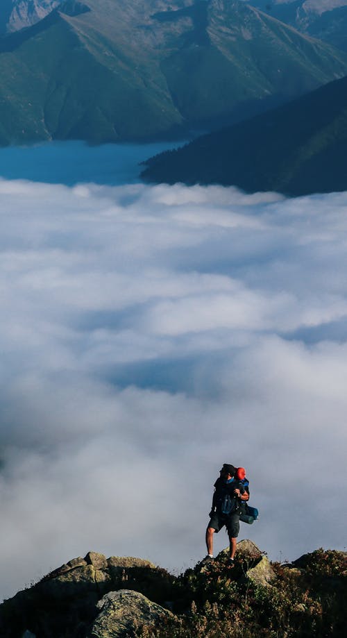 Man on Rocks in Mountains