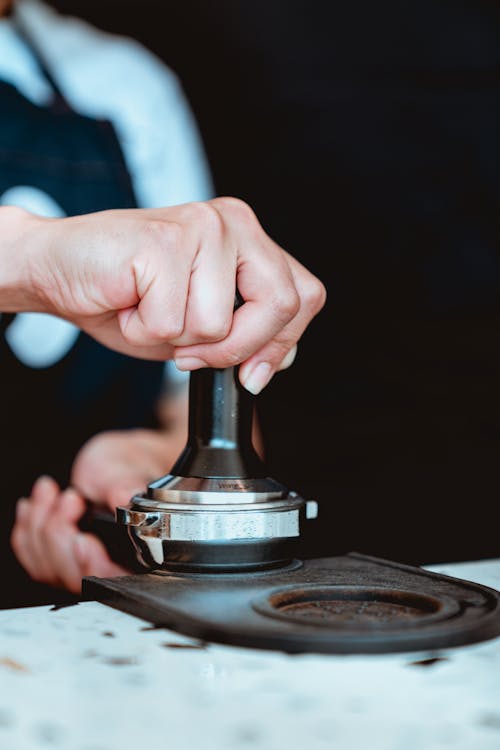 Photo of Person Preparing Coffee